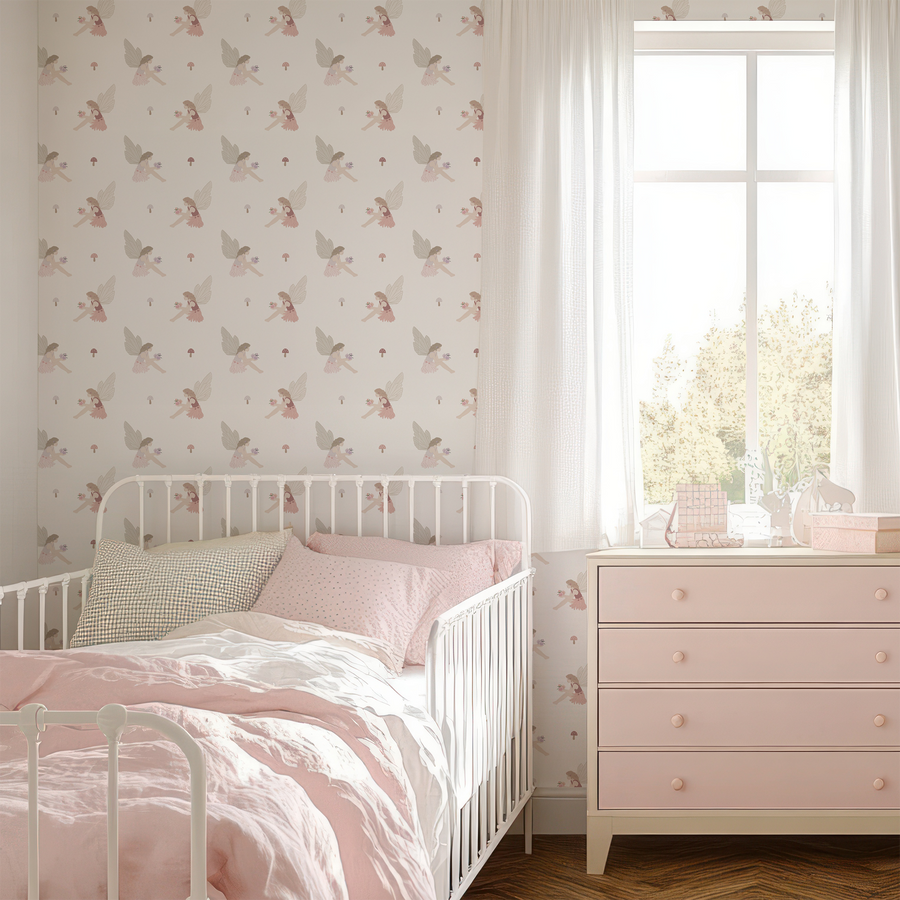 A children's room with a white metal bed and light pink drawers featuring 'Flora' which is a whimsical children's wallpaper featuring fairy girls, woodland flowers, butterflies and forest animals in a charming repeating storybook pattern.