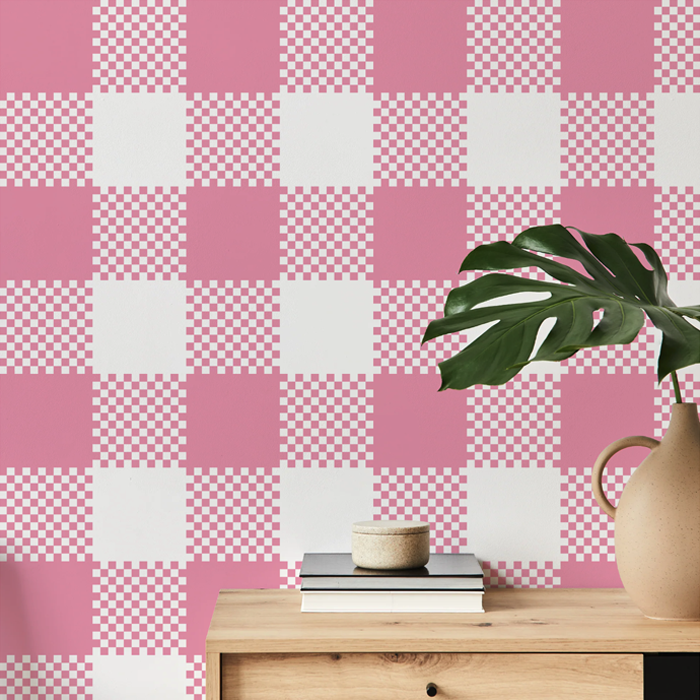 Blossom pink plaid wallpaper on a hallway wall with an oak console table and monstera